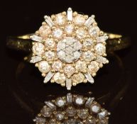 A 9ct gold ring set with round and baguette cut diamonds in a cluster, 3.5g, size Q