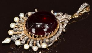 Victorian pendant set with a foiled garnet cabochon (20 x 24.4 x 9mm), old cut and rose cut diamonds