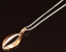 An 18ct gold boat shaped pendant set with diamonds (3.4cm) on 18ct white gold chain, 10.9g, 39cm