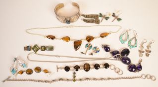 A collection of silver jewellery including two bracelets set with amethyst and smoky quartz,