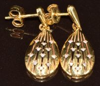A pair of 18ct gold earrings in a pear shape set with diamonds in a pierced setting, 4.6g