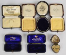 Seven vintage jewellery boxes including Waghorn Bros, Croydon, W.W.Wilson, Croydon, Mappin & Webb,