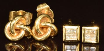 A pair of 18ct gold knot earrings (2g) and a pair of yellow metal earrings each set with four