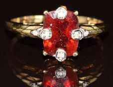 A 9k gold ring set with a red paste and diamonds, 2.4g, size Q