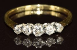 An 18ct gold ring set with five diamonds, 1.9g, size M
