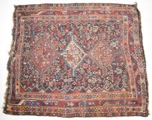 Persian Shiraz rug with central gul on a wine ground, 190 x 165cm
