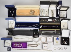 A collection of jewellery including silver bangle, Swarovski necklace and earrings in original