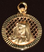 A 9ct gold Virgin Mary pendant, 24mm diameter, 2.2g