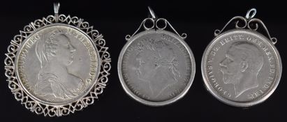 Three mounted silver coins comprising 1821 George IV crown, 1935 George V rocking horse crown and