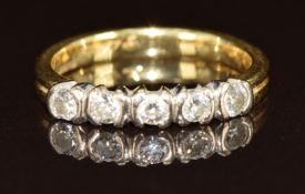 An 18ct gold ring set with diamonds in a platinum setting, 3g, size U