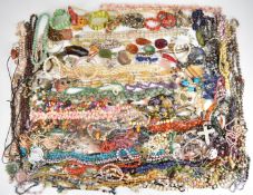 A large collection of agate, amethyst, coral, pearl and shell jewellery including necklaces,