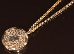 A 9ct gold locket with scrolling decoration (Birmingham 1908) on 9ct gold chain made up of faceted