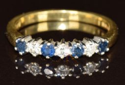 An 18ct gold ring set with diamonds and sapphires, 2.7g, size L