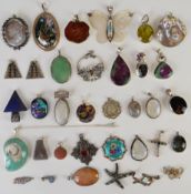 Sixty silver pendants including abalone, labradorite, amethyst, glass, mother of pearl, enamel,