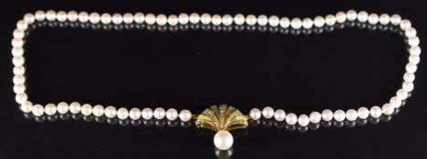 A single strand of cultured pearls, the 9ct gold clasp in the form of a fan set with diamond and a