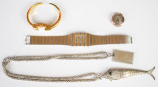A silver fish, ingot, and three watches
