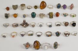 Thirty-six silver rings including amethyst, opal mosaic, agate, moss agate, Caithness, sapphire,