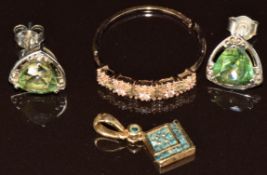 A 9ct gold pendant set with blue diamonds, a 9ct gold ring set with diamonds and sapphires (2.9g)