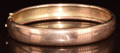 A 9ct rose gold bangle, 12.8g, 5.4 x 4.6cm