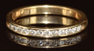 A 14ct gold half eternity ring set with twelve round cut diamonds, total 0.27ct, 2.3g, size M