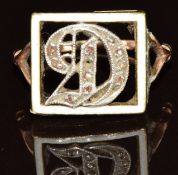 A 9ct gold ring set with enamel and rose cut diamonds in the shape of 'D', 3.1g, size J/K
