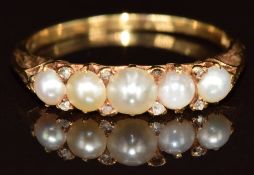 A c1900 18ct gold ring set with split pearls and rose cut diamonds (one diamond missing), 2.7g, size