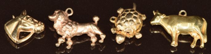 Three 9ct gold charms / pendants in the form of a tortoiseshell, lion & horse head (8.6g) and a