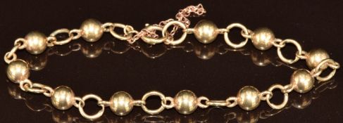 A 9ct gold bracelet made up of circular and spherical links, 8.4g, 18cm