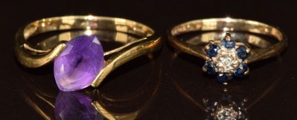 Two 9ct gold rings, one set with a diamond surrounded by sapphires and the other a marquise cut