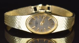 Rotary 9ct gold ladies wristwatch with two-tone hands and baton hour markers, silver dial and quartz