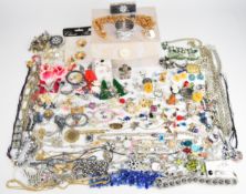 A collection of jewellery including two Butler and Wilson necklaces, vintage brooches, earrings,