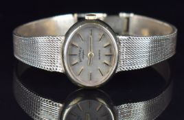 Rotary 9ct gold ladies wristwatch with two-tone hands and baton hour markers, silver dial and quartz