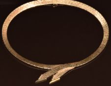 A 1960's 9ct gold necklace made up of textured rectangular links and arrow decoration, 48.4g, 42cm