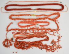 Ten coral necklaces including three c1900 with barrel clasps, and some loose coral beads