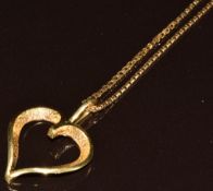 An 18ct gold heart pendant on 18ct gold chain made up of rectangular box links, 9.4g, 2.2cm, 46cm