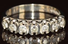 An 18ct white gold ring set with seven diamonds, each approximately 0.05ct, 3.6g, size N