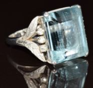An 18k white gold ring set with an emerald cut aquamarine of approximately 16ct and diamonds, with