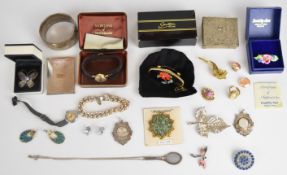 A collection of costume jewellery including silver bangle (Birmingham 1938), silver tennis