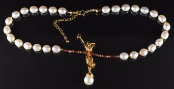 A freshwater pearl and garnet necklace by Stella Sarmiento and Vale Ola, 38cm
