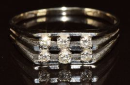 An 18ct white gold ring set with six diamonds, 3.8g, size V