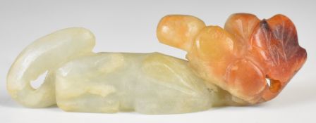 Chinese jadeite carving in the form of an animal and shrubbery, 72mm long.