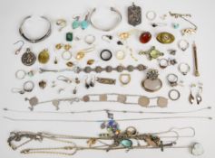 A collection of mostly silver jewellery including 999 silver pendant depicting a dragon, two