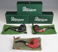Three Peterson Sherlock Holmes smoking pipes comprising 'Hansom' With Silver Spigot, Pipe Of The