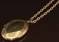 A 9ct gold locket with engraved border, on 9ct gold chain, 14.2g, 4cm, 46cm