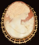 A 9ct gold brooch set with a cameo depicting a young woman, 20g, 5.5 x 4.4cm