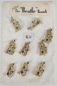 Nine Exquisite Beatles brooches 'The 'Beatle' brooch', on original shop display