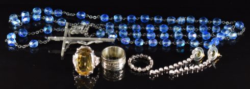 A pair of Swarovski earrings in original box, two silver rings, an unmarked ring and a rosary