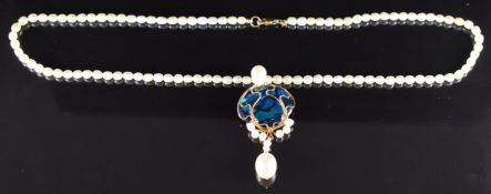 A single strand of cultured freshwater pearls with 9k gold clasp and an abalone and freshwater pearl