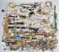 A collection of jewellery including silver rings, bangles, brooches, gold plated chains, rose quartz