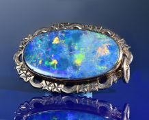 A 9ct gold pendant set with a black opal doublet, 8.6g, 3.5 x 2.2cm
